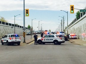 OPP officers, with the assistance of Windsor police, arrest a man on Walker Road on May 9, 2017.