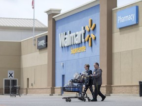 Shoppers walk out of the Walmart Supercentre in Windsor's east end on May 9, 2017.