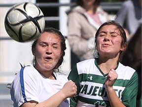 Katie Zuccato of Cardinal Carter, left, and Erika Boismier of Lajeunesse battle for the ball during their WECSSAA girls' A soccer championship game on May 15, 2017.