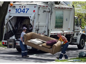 File photo of Windsor garbage crew picking up a sofa