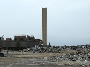 A tower at the former GM transmission plant off Walker Road remained standing after an explosion failed to bring it down on Aug. 10, 2015.