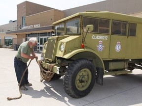 Geoff Bottoms, founder of Southern Ontario Military Muster, prepares a Windsor-built 1943 Ford field artillery tractor on May 17, 2017 at WFCU Centre where many displays are rolling out for 2017 Mastercard Memorial Cup. Bottoms has personally repaired many of the vehicles on display. The '43 Ford comes equipped with a flathead V-8 and was built in Ford of Canada's old, riverfront assembly plant.