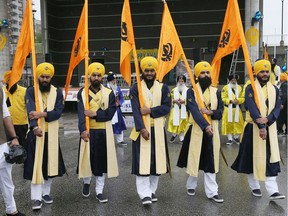 A row of five beloved gurus prepare to join other members of the Sikh community during the annual Vaisakhi, Khalsa Day Celebrations on May 21, 2017.