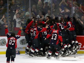 The Windsor Spitfires celebrate after defeating the Erie Otters in the final game of the Memorial Cup at the WFCU Centre in Windsor on May 28, 2017.
