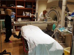 Laurie Casagrande, left, and Lori Bezarie prepare the MRI for the next patient at the Windsor Regional Hospital Met Campus in Windsor on Sept. 24, 2015.