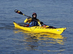 In this Jan. 10, 2012 file photo, kayaker Bruno Zongaro paddles his kayak near the Windsor shoreline of the Detroit River.