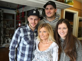 Ilona Wojdylo, from centre, is surrounded by her children Christian, from left, Patrick, and Jessica May 1,2017. The family is raising money to help send Ilona to Mexico to receive alternative medicine cancer treatments.