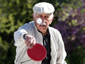 Tareq Albayati, 79, returns a shot while playing ping pong at Kiwanis Park in east Windsor on May 15, 2017.