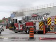 Windsor firefighters work the scene of a fire at the former Zellers store at Tecumseh Mall in Windsor on May 19, 2017. A fire crew was called after reports of a piece of machinery was on fire inside the building. The location is currently under renovations and workers were present on the scene. Workers from HGS Canada were evacuated from the neighbouring business. Windsor fire officials are investigating the cause.
