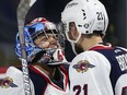 Windsor Spitfires goaltender Michael DiPietro celebrates with teammate Logan Brown after the Spitfires defeated the Seattle Thunderbirds 7-1 during a Memorial Cup round-robin game at the WFCU Centre in Windsor, Ont., on May 21, 2017.