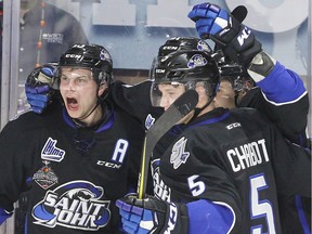 Saint John Sea Dogs Matthew Highmore, left, celebrates with Thomas Chabot and goalscorer Mathieu Joseph, behind, against the Seattle Thunderbirds in 2017 Mastercard Memorial Cup hockey action from Windsor's WFCU Centre on May 23, 2017.