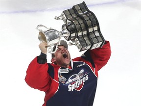 Windsor Spitfires goaltender Michael DiPietro holds up the Memorial Cup after the Spitfires defeated the Erie Otters to win the championship at the WFCU Centre in Windsor, Ont., on May 28, 2017.