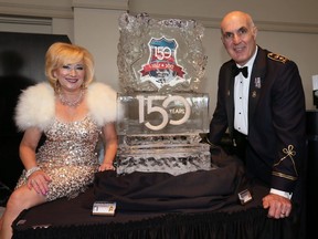 Charity Chix co-ordinator Kim Spirou, left, and Windsor Police Service Chief Al Frederick pose with ice sculpture at Windsor Police Services 150th Anniversary Gala at St. Clair College Centre for the Arts on May 3, 2017. The Charity Chix hosted the event. Proceeds from the gala support Law Enforcement Torch Run, the Safety Village, Windsor Essex Regional Youth Council and John Atkinson Memorial Fund.