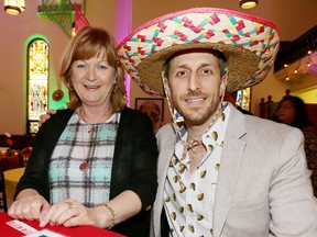 Jacky Hunt, left, and Lucas Labute,  both with Windsor Tent and Awning, attend Scotiabank and Transition to Betterness Cinco De Mayo Fiesta at Water's Edge Event Centre. The fundraiser supports T2B's Holiday Meal program.