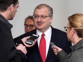 Russian Ambassador Alexander Darchiev, centre, is interviewed by media during a V-E Day ceremony at Art Gallery of Windsor on May 6, 2017.