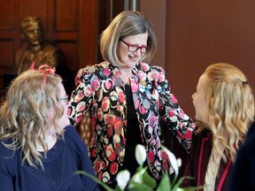 Doris Ginspun, CEO of Registered Nurses' Association of Ontario greets University of Windsor students Lauren Medbury, 21, left, and Rachel Wiens, 20, during a public social event at Willistead Manor May 7, 2017.