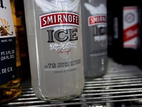 FILE - In this Jan. 28, 2008, file photo, bottles of Smirnoff Ice are seen on a cooler shelf at a store in Albany, N.Y. The vodka brand told The Associated Press on June 12, 2017, that it has launched a new ad campaign that references the ongoing investigation into Russian interference in last year‚Äôs presidential campaign. (AP Photo/Mike Groll, File)