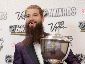 Brent Burns of the San Jose Sharks poses with the James Norris Memorial Trophy after winning the award during the NHL Awards, Wednesday, June 21, 2017, in Las Vegas. (AP Photo/John Locher)