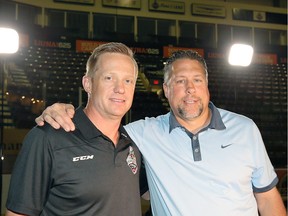 Windsor Spitfires head coach Trevor Letowski, left, saw his team beat former Spitfires co-owner and general manager Warren Rychel, right, who is now interim head coach of the Barrie Colts, in a shootout on Saturday at the WFCU Centre.