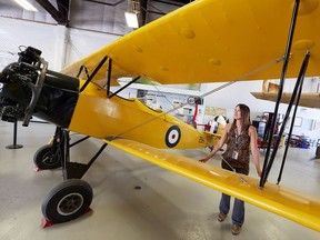 Nicole Hutchinson of the Canadian Historical Aircraft Association stands next to a vintage 1930 Fleet Fawn bi-plane on June 21, 2017.