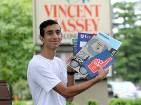 Massey graduate Abhi Gupta holds books from different American universities on June 23, 2017. Gupta will be attending Columbia University, the Ivy League school located in New York, N.Y.