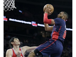 Detroit Pistons' Darrun Hilliard goes to the basket against Philadelphia 76ers' Ersan Ilyasova during the first half of an NBA basketball game on Dec. 11, 2016, in Auburn Hills, Mich.