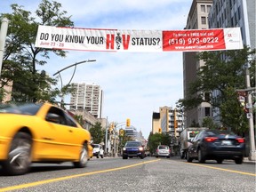 A banner from the AidsWindsor.org is displayed over Ouellette Avenue in downtown Windsor on June 28, 2017.