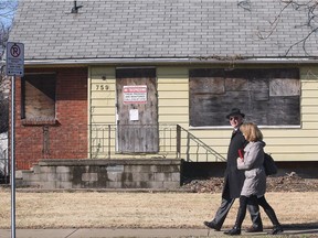 Superior Court Justice Thomas Carey and a court clerk are shown on Indian Rd. in Windsor on March 21, 2017. The judge and lawyers took a walking tour of the area in conjunction with the ongoing trial against the Ambassador Bridge company.