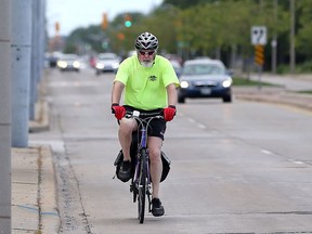 Avid cyclist John Harvie rides in the eastbound lanes of Wyandotte Street East on June 19, 2017.