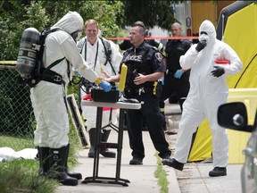 Windsor Police and fire service proceeding with caution in 700 block of Dougall where a dead body was found with white powder nearby.