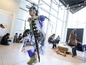 Chayton Hedgebeth, 15, performs a grass dance dressed as a First Nations member of the Oneida Nation, during a free admission day at the newly opened Chimczuk Museum, Feb. 20, 2016.