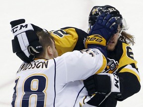 Nashville Predators' Viktor Arvidsson, left, and Pittsburgh Penguins' Carl Hagelin trade punches during the third period in Game 5 of the NHL's  Stanley Cup Final on June 8, 2017, in Pittsburgh.