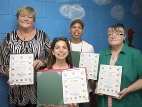 Shining Light on Compassion Award recipients, from left, Debbie Desjardins, Maya Mikhael, 11, Teajai Travis, and Sandy Marentte, who accepted on behalf of her late husband, Roland 'Rolly' Marentette, are pictured at the Sandwich Teen Action Group, Friday, June 23, 2017.
