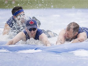 Employees at Reko International compete at the Windsor Corporate Challenge at the Vollmer Complex, Saturday, June 17, 2017.