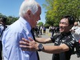 Roger Penske, left, chats with Indianapolis 500 winner Takuma Sato at the Detroit Yacht Club on Belle Isle on Thursday, June 1, 2017.