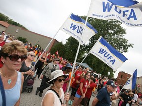 (file) Workers with the Windsor University Faculty Association stand front and centre during speeches for Labour Day at the Fogolar Furlan on Sept. 1, 2014.