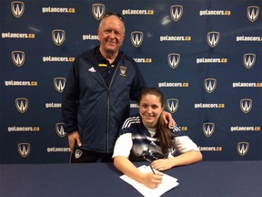 Newly signed women's soccer recruit Sophia Ferrazzo, right, is joined by Lancers head coach Steve Hart.