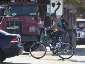 A cyclist crosses Tecumseh Road East at Lauzon Parkway on Nov. 7, 2016.