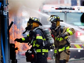 Windsor firefighters battle a commercial fire in the 300 block of Ouellette Avenue on June 14, 2017.