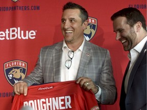 Florida Panthers' new coach Bob Boughner shares a laugh with Panthers President & CEO Matthew Caldwell Monday, June 12, 2017, in Sunrise, Fla.
