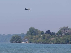 An OPP helicopter searches on May 29, 2017, for the missing canoeist who disappeared under the water near Kingsville the evening before.