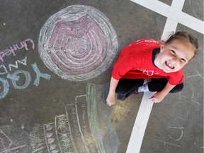 WEtech Alliance celebrated World Social Media Day on June 30, 2017 at Lanspeary Park. Charlotte Misur, 7, was one of many chalk artists attending the event.