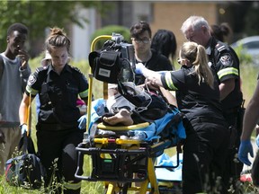 Paramedics tend to a 16-year-old boy who was struck by a minivan in the 1900 block of Dominion Boulevard on June 5, 2017.