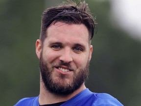 In this May 24, 2017, photo, Detroit Lions offensive tackle Taylor Decker watches during an NFL football practice in Allen Park, Mich. Decker has had shoulder surgery and is out indefinitely. Lions coach Jim Caldwell says Decker was injured last week during an offseason workout.