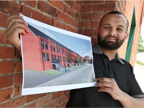 Anuj Sood, manager with Champion Products, holds an architectural rendering of a proposed  townhouse development along Walker Road.  There will be between 200 and 250 units, including condos, townhomes and houses on 15 acres.