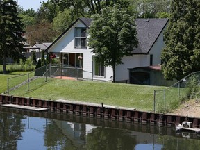 A berm can be seen on property backing onto Little River on Riverdale Avenue in Windsor on June 1, 2017.