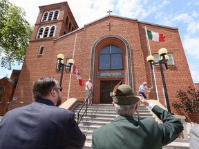 City of Windsor councillor Rino Bortolin, left, and Vittorino Moraset of Alpini Nationale Windsor pause during the raising of the Italian flag at St. Angela Merici Church on June 2, 2017. Canadian Italian Business and Professional Association, St. Angela Merici Church, Erie Street BIA and Voce Ciociare held the event marking Italian Heritage Month.