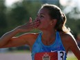Former University of Windsor standout Melissa Bishop blows a kiss to the crowd on her victory lap after winning gold in the women's 800 metres at the Canadian Track and Field Championships in Ottawa, July 8 2017.