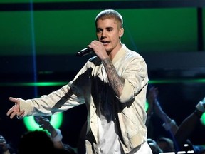 FILE - In this May 22, 2016 file photo, Justin Bieber performs at the Billboard Music Awards in Las Vegas. Bieber is canceling the rest of his Purpose World Tour ‚Äúdue to unforeseen circumstances.‚Äù In a statement released Monday, July 24, 2017, his representatives didn‚Äôt offer details about the cancellation but said the singer ‚Äúloves his fans and hates to disappoint them.‚Äù He has been on the tour for the last 18 months, playing more than 150 shows in six continents. (Photo by Chris Pizz