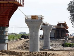 FILE - In this Feb. 26, 2016 file photo, the supports for a 1,600-foot-viaduct to carry high-speed rail trains across the Fresno River stand under construction near Madera, Calif. The California Supreme Court is set to issue a ruling that could have big implications for the state&#039;s $64 billion high-speed rail project. The court will decide Thursday, July 27, 2017, whether federal law exempts rail projects such as the planned bullet train between Los Angeles and San Francisco from the state&#039;s str